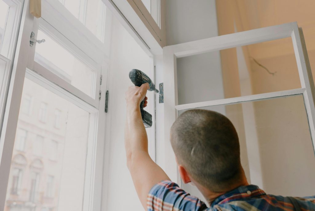 Man installing a window frame